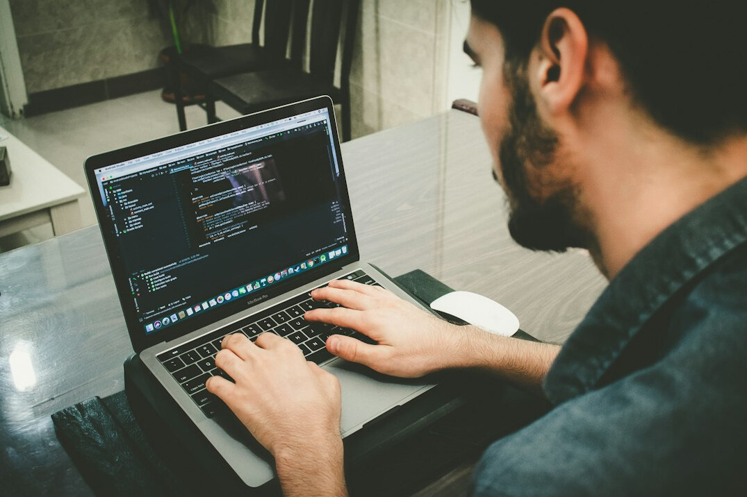 software developer writing code for insurance