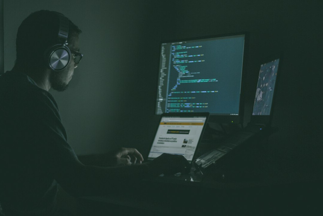 software developer writing code for insurance