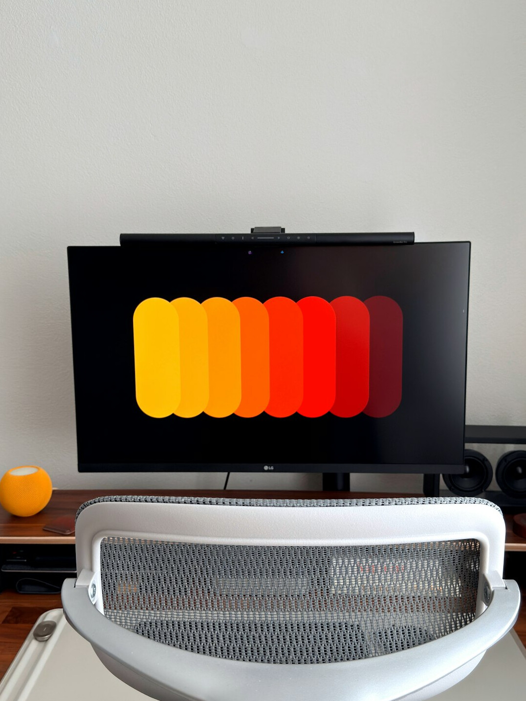 Laptop displaying a colorful data visualization dashboard on a desk